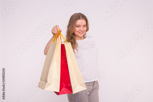 Blondie young woman with shopping bags