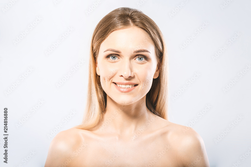 Beauty Woman face Portrait. Beautiful Spa model Girl with Perfect Fresh Clean Skin. Blonde female looking at camera and smiling. Youth and Skin Care Concept Beauty Woman face Portrait. Beautiful Spa model Girl with Perfect Fresh Clean Skin. Blonde female looking at camera and smiling. Youth and Skin Care Concept