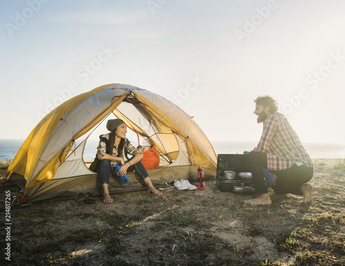 Couple camping on beach photo