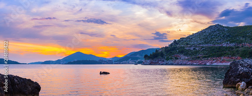 Awesome colorful sunset on the Adriatic sea coastline in Montenegro  gorgeous seascape  panoramic view