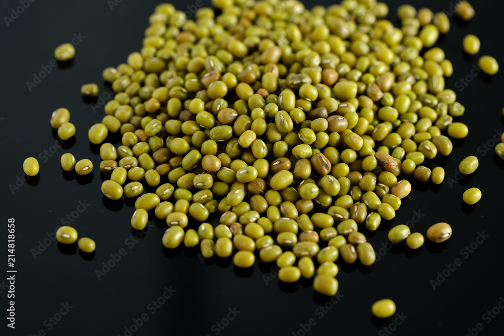 dry beans, mung beans, on a black background dry beans, mung beans, on a black background