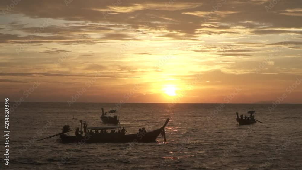 Group of Long Tail Boats at Sunset - Phi Phi Island Thailand Group of Long Tail Boats at Sunset - Phi Phi Island Thailand