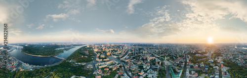 A big 360 degrees panorama of the city of Kiev at sunset. A modern metropolis in the center of Europe against the backdrop of sunset sky from a bird's eye view. Aerial view. Panorama of the Tourist