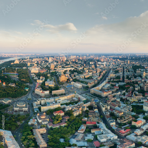 Panorama of the city of Kiev at sunset. A modern metropolis in the center of Europe against the backdrop of sunset sky from a bird s eye view. Aerial view. Panorama of the Tourist Center of Kiev.