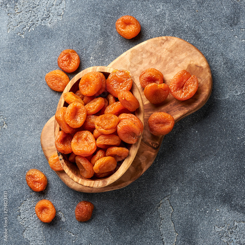 Dried apricots on gray background. Top view. photo