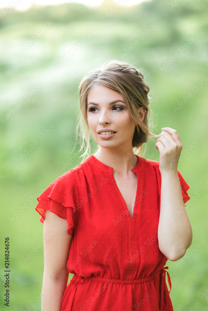Beautiful young happy girl in the blossoming fields, thinking about her life and goals. Slow life, minimalism, mindfulness Beautiful young happy girl in the blossoming fields, thinking about her life and goals. Slow life, minimalism, mindfulness