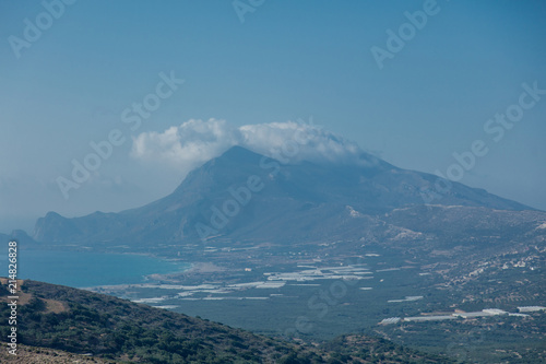 View at olive tree gardens near a sea coast and mountains on west Crete, Falassarna region, Greece