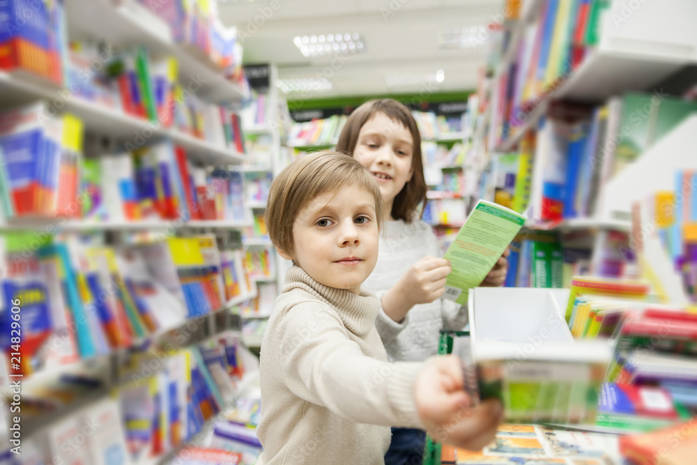 girls choosing books in bookstore for school girls choosing books in bookstore for school
