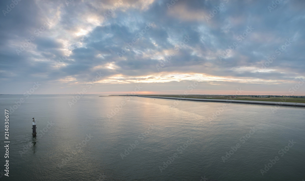 Fototapeta premium Beautiful and colorful sunset sky over the North Sea, Holland