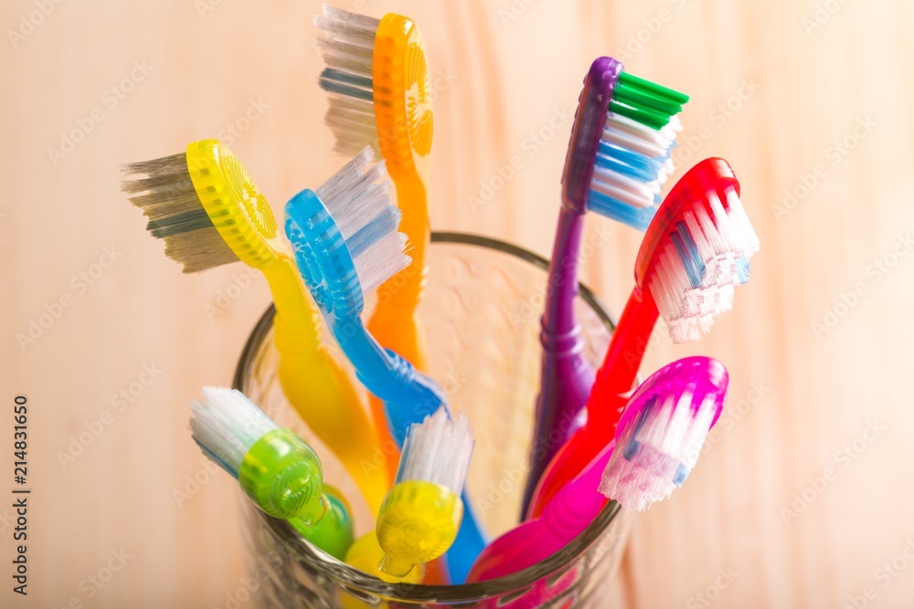 Toothbrushes in a Glass Toothbrushes in a Glass