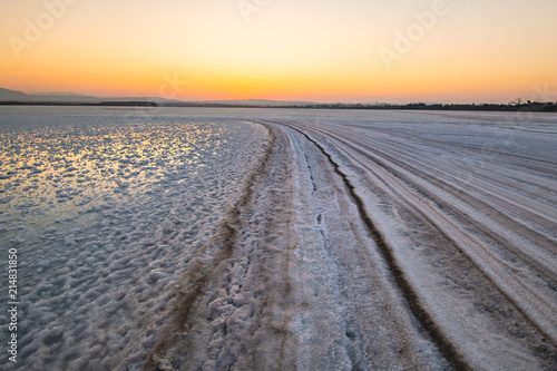 Salty path to the sun - A sunset at the salt lake