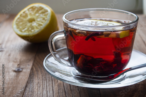 brewed in a cup of fruity red tea with lemon