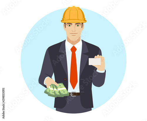 Businessman in construction helmet with money showing the business card