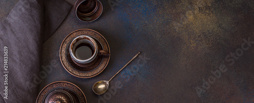 Turkish Coffee on the Dark Background Retro Style Two Bronze Cups photo