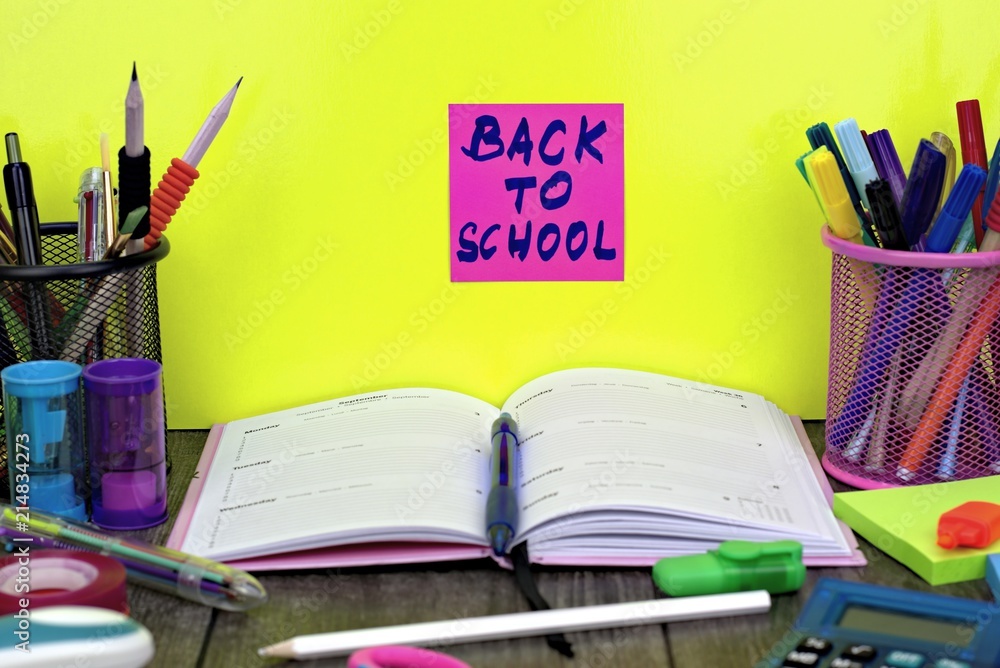Back to school concept: close-up of school supplies with back to school background. Back to school concept: close-up of school supplies with back to school background.