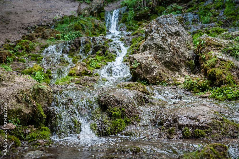 View of cascading water falling over the rocks. Waterfall of The Seven Springs in Gauja national park. Latvia. View of cascading water falling over the rocks. Waterfall of The Seven Springs in Gauja national park. Latvia.
