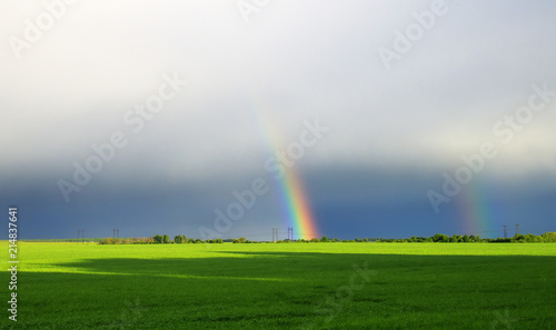 background with bright colorful rainbows in the distance on the horizon of a ...