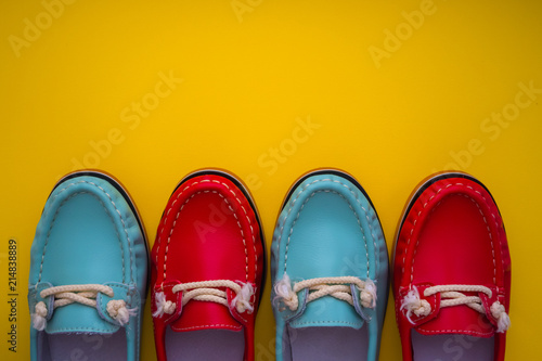 blue and red moccasins on a yellow background