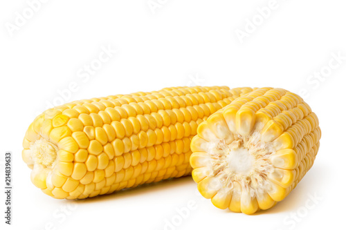 Ripe peeled corn close-up, on a white.