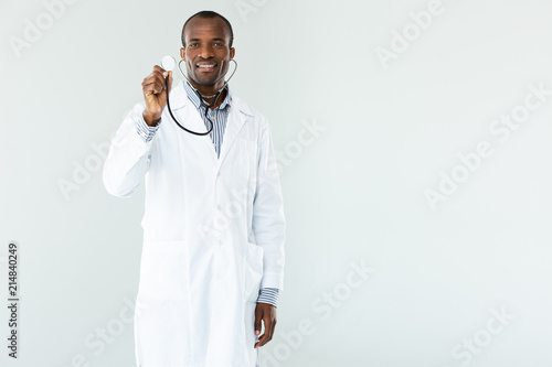 Smiling professioanl doc using his stethoscope photo