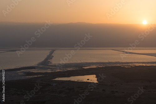 Ecology disaster in Istael, lowest salty lake in world below sea level Dead sea, full of minerals near Ein Bokek, perfect place for medical treatments photo