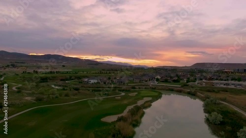 Wallpaper Mural Flying backwards over a river and golf course with a stunning sunset in the distance and the colorful sky reflecting off the water Torontodigital.ca