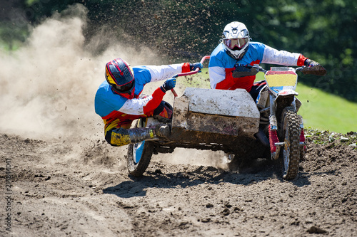 Sidecar during the passage on the motocross track photo