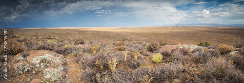 Canvas Print Panoramic views over the Tankwa Karoo Desert with dramatic thunderclouds in the