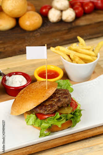 Fresh tasty burger with french fries and sauce