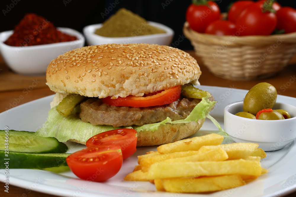 Delicious burger with french fries Delicious burger with french fries