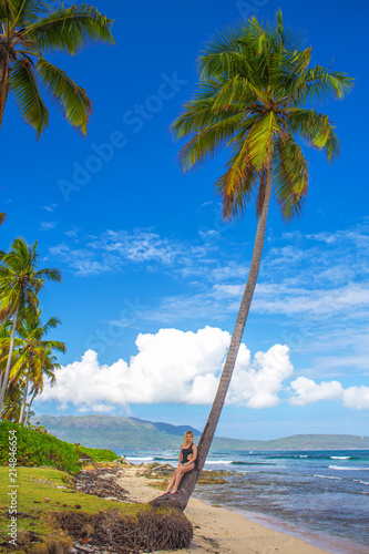young girl on palm tree