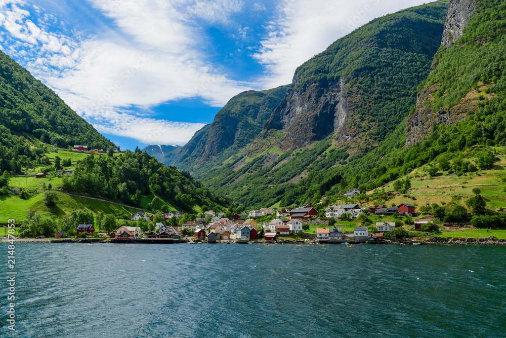 View of the village of Undredal from the fjord.  Neroyfjord offshoot of Sognefjord is the narrowest fjord in Europe. Norway, Europe.