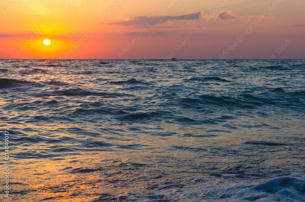 Amazing sea sunset, the sun, waves, clouds