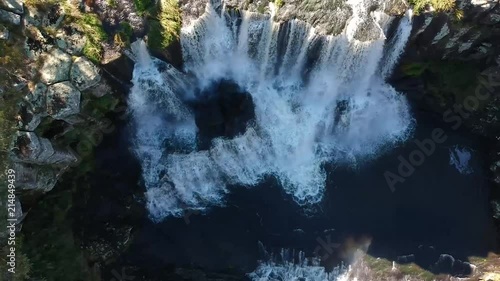 Over head reveal of epic waterfall ebor falls on waterfall way in New South Wales, Australia. Epic aerial view of waterfall photo