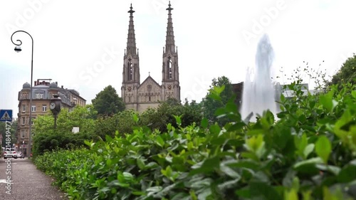 View on Protestant Church and fountain on a gloomy rainy day  in Baden Baden, Germany photo
