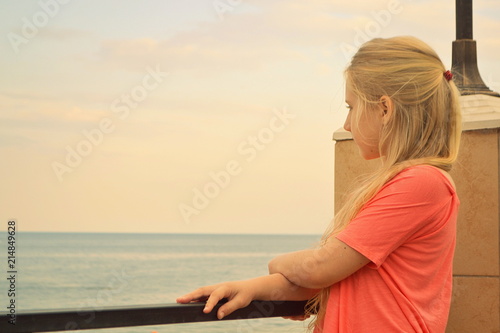 blonde girl near the sea in summer close up selective focus © Olga