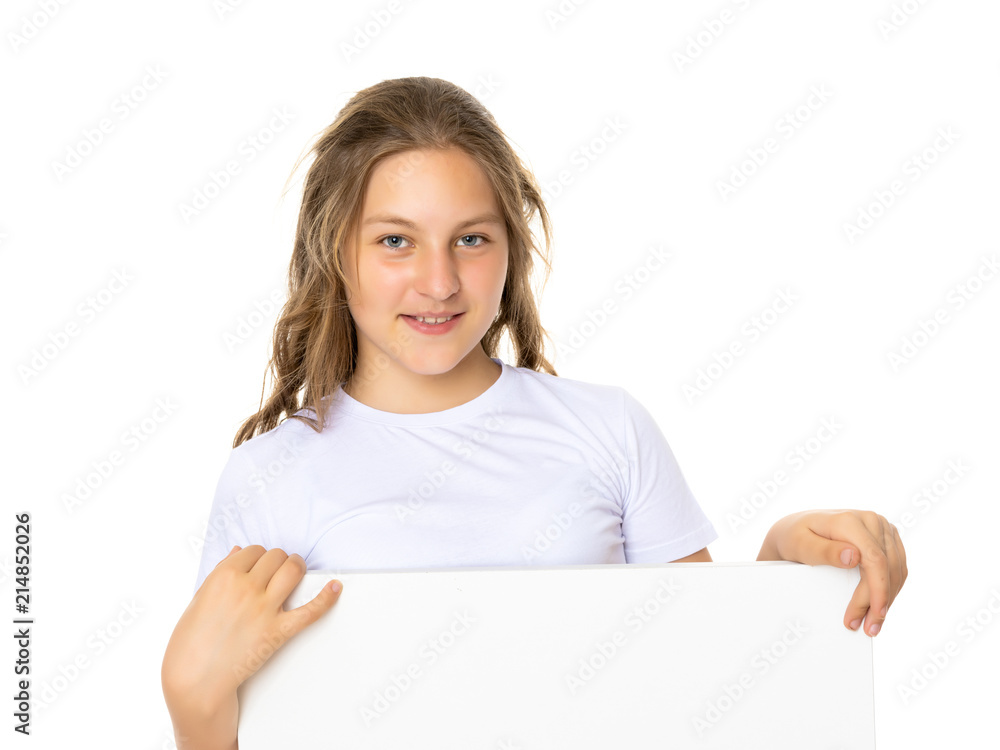 Little school girl pointing to her empty white t-shirt. Little school girl pointing to her empty white t-shirt.