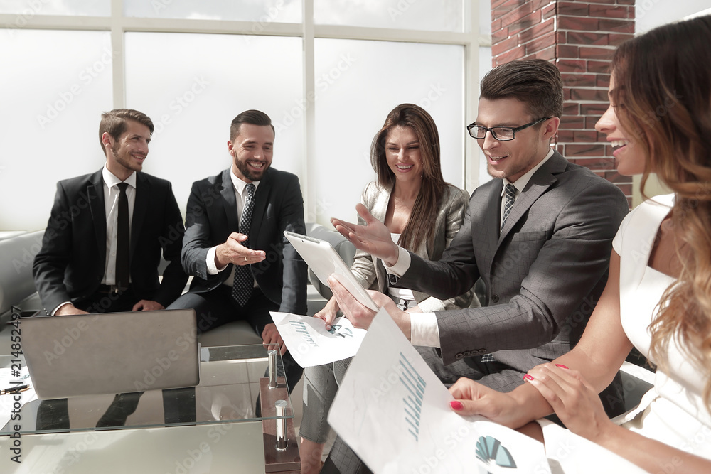 business team discussing financial documents. business team discussing financial documents.