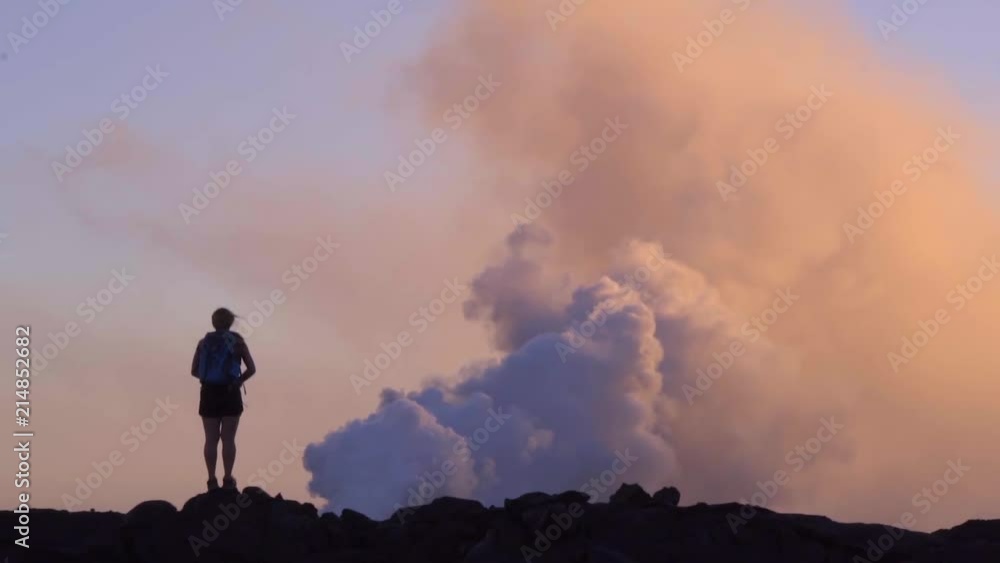 Adventure Girl Standing by Erupting Kilauea Volcano at Sunset in Hawaii