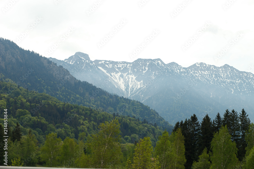 landscape in the Alps with snow-capped mountain peaks in the background, Bavaria, Germany