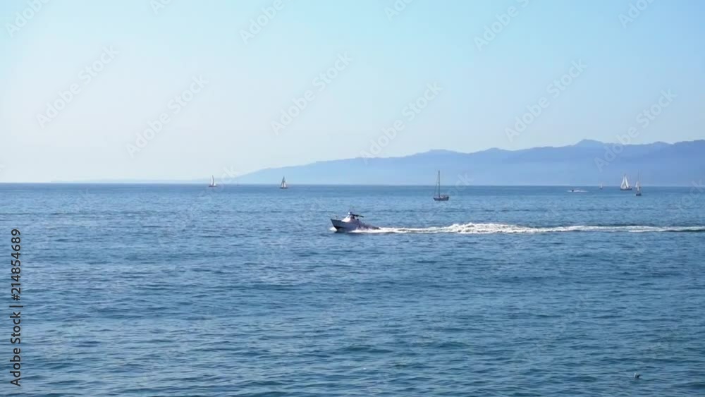 Lifeboat jetting across the Pacific Ocean off Santa Monica beach, California. Lifeboat jetting across the Pacific Ocean off Santa Monica beach, California.