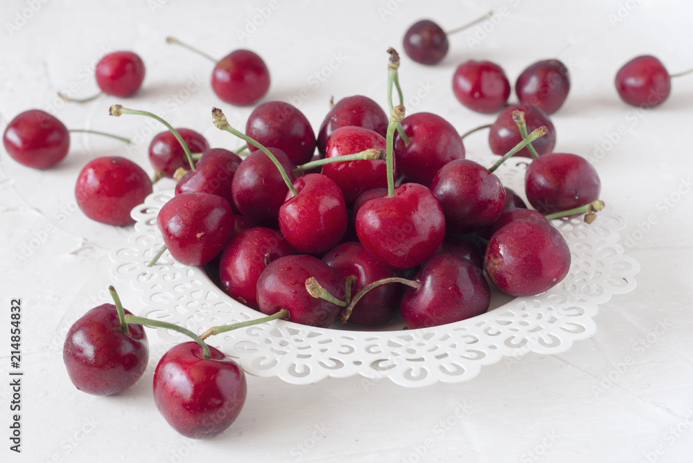 ripe cherries on white board painted with chalk ripe cherries on white board painted with chalk
