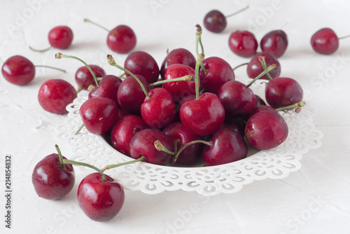 ripe cherries on white board painted with chalk