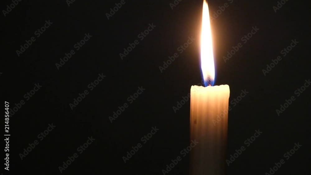 burning candles and pine cones against a dark backdrop in a Christmas scene burning candles and pine cones against a dark backdrop in a Christmas scene