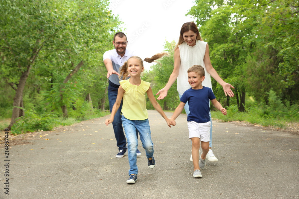 Happy family spending time together with their children outdoors Happy family spending time together with their children outdoors