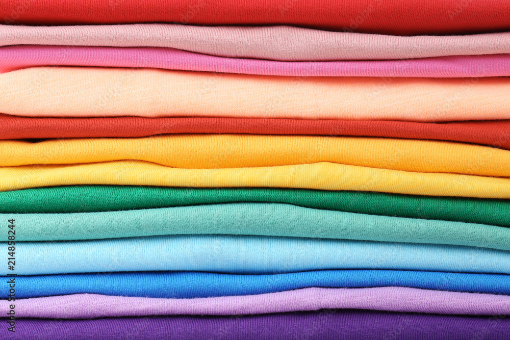 Stack of colorful t-shirts, close up view Stack of colorful t-shirts, close up view