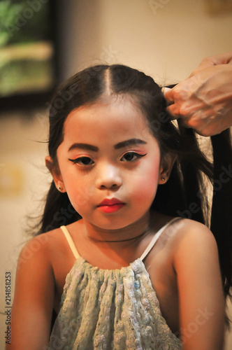 Little girls character creation set. Icons with different types of faces and hair style. she happy sitting in home, hair braiding ,doing make-up photo