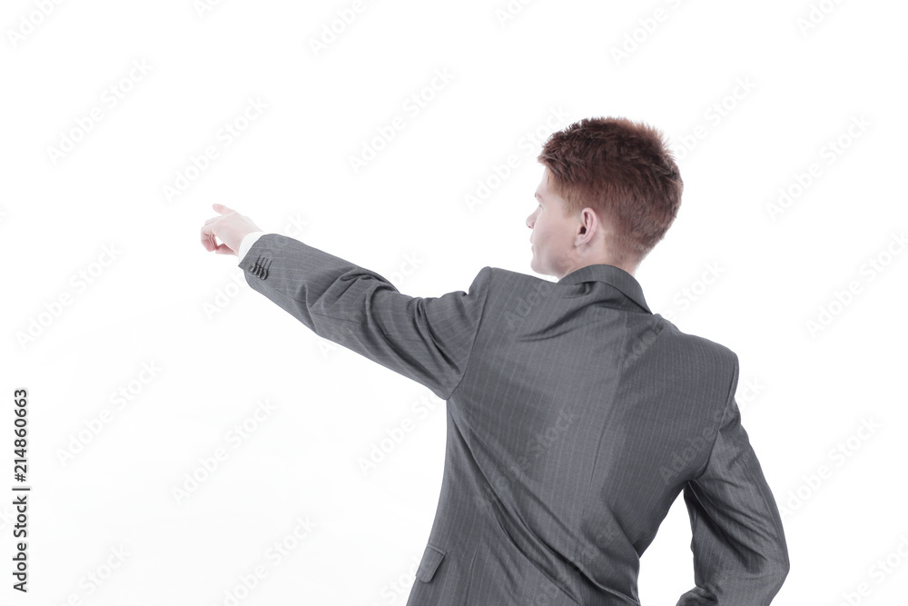 rear view.businessman pointing at a blank screen rear view.businessman pointing at a blank screen