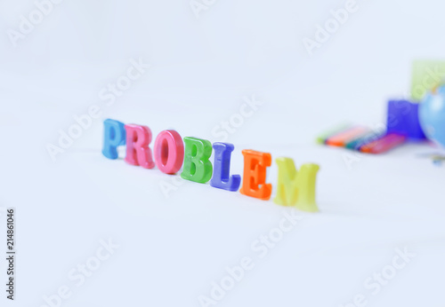 words problem on blurred background of school supplies .photo with copy space