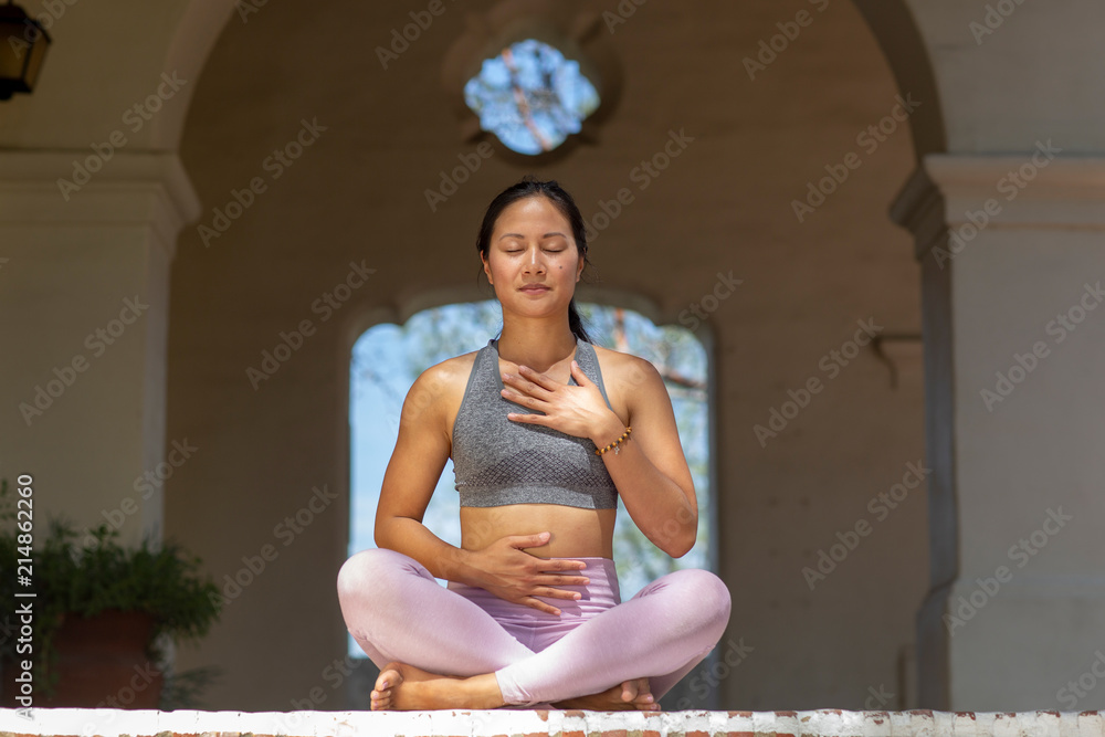 Premium Photo  Beginner student athletic girl meditates sitting in sports  hammock fly yoga portrait of young woman during meditation black background